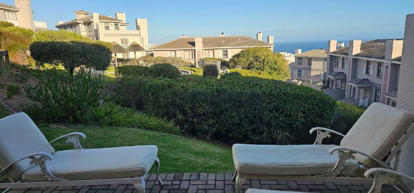 View from the patio over the estate to the sea